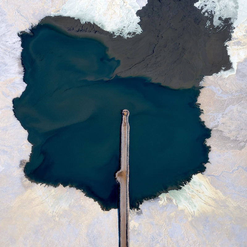 Aerial photography of a lake surrounded by a salt mining in Western Australia