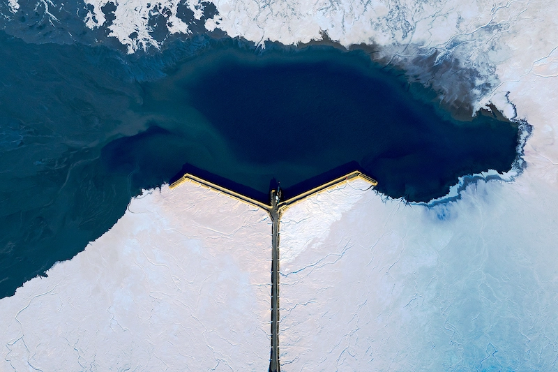 Aerial photography of a lake surrounded by a salt mining in Western Australia