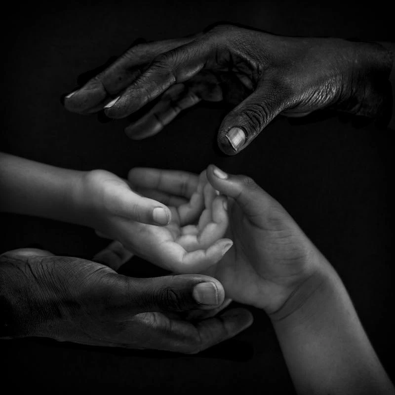 Photography of adults' hands and children's hands