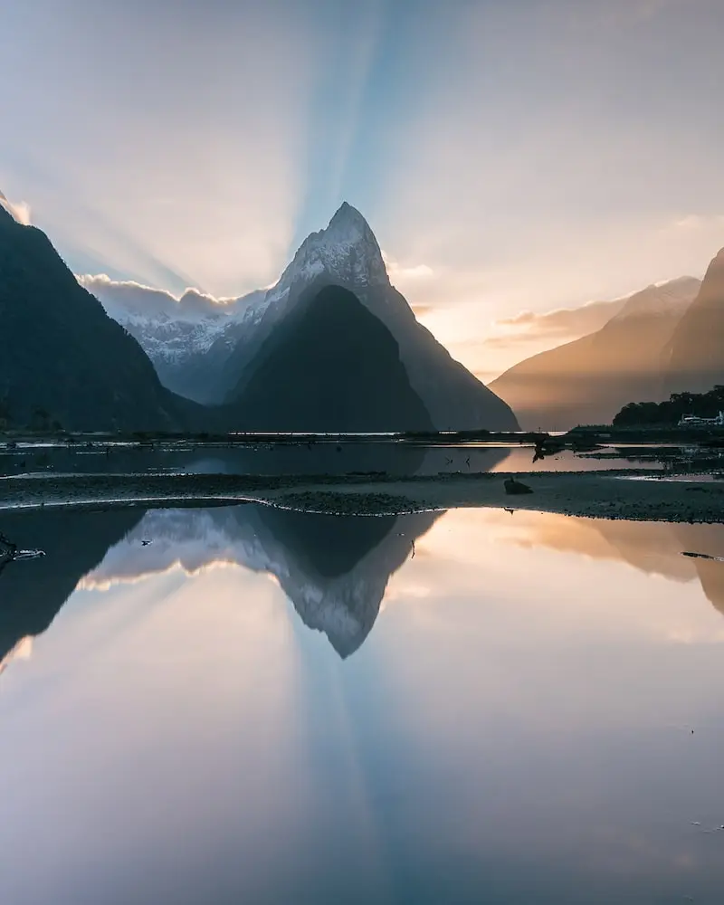 Photography of the reflection of a mountain on water