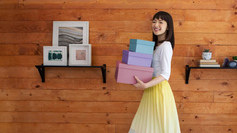 Portrait of Marie Kondo, expert in teaching when no keep or throw things... such as photos