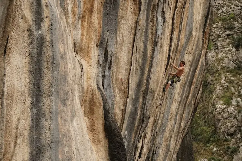 Seb Bouin on a cliff